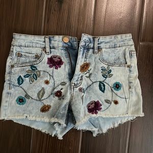 High rise, size 4 (stretchy) light wash shorts with flower embroidery